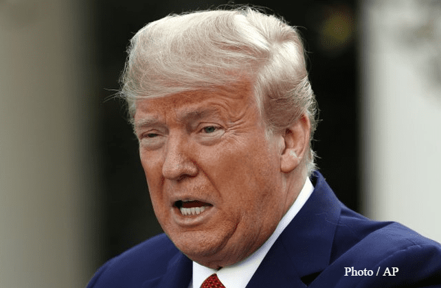 Trump extends virus guidelines, braces US for big death toll